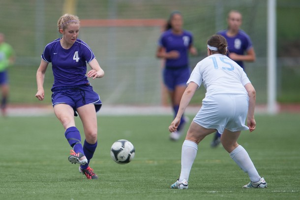 Pioneer's Julia Crowe drives the ball up filed against Skyline's Carmen Flesher during the first half the district finals, Friday May 31.
Courtney Sacco I AnnArbor.com